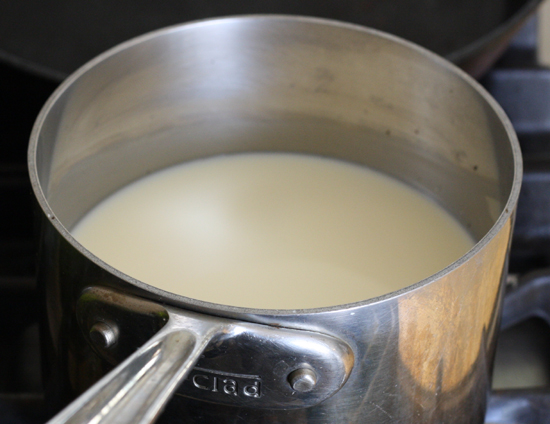 Heating milk in a saucepan.