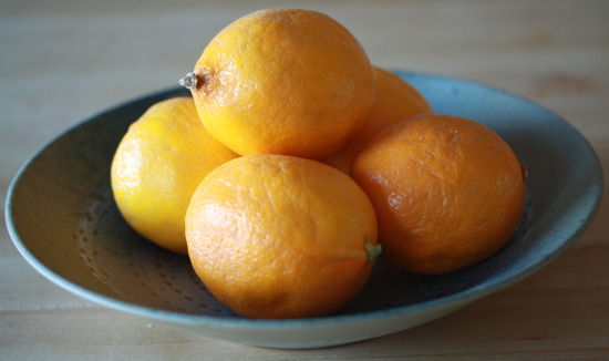 Meyer lemons in a shallow bowl.