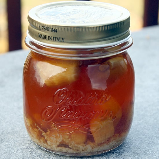 Garlic honey in a glass jar.