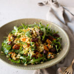 close up image of vegetable winter salad with wheat berries in a plate