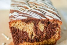 cropped image of a single loaf of chocolate and ginger cake, showcasing the marbled interior