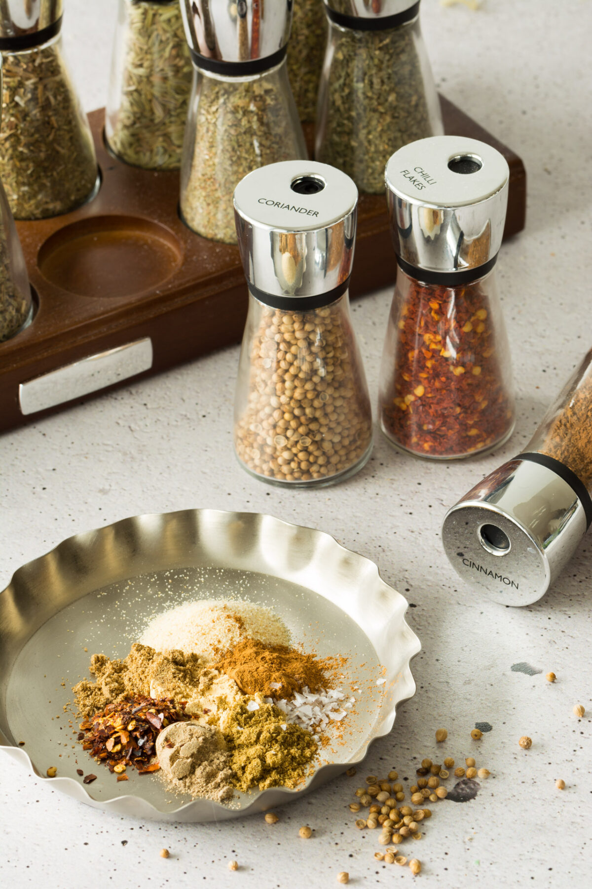 an image of seasoning and spices, coriander, chili flakes, cinnamon mix together 