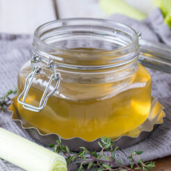 cropped image showcasing a glass canister filled with flavorful homemade vegetable stock