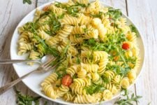 A Lemon Rocket Pasta Salad full of freshness and green goodness. The large fusilli pasta is tossed in fresh lemon juice and just a little olive oil to create this bright, vibrant salad, perfect for a cold lunch on a hot day!
