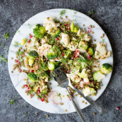 A delicious, crunchy salad, perfect for packing up and enjoying on a summer picnic! The cauliflower is lightly chargrilled, giving it that smoky flavour reminiscent of a summer barbeque, then it’s tossed with warm, lemony lentils and topped with fresh broccoli, radishes, pomegranate seeds and manchego cheese!