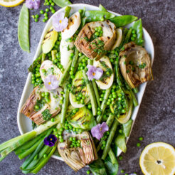 Simple grilled spring greens with homemade lemon parsley butter make the perfect side dish as we start to welcome some sunshine to the year!