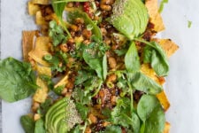 Loaded Vegan Nachos with Harissa Beans, the perfect easy snack for a hot summer's day!