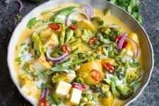 This creamy Vegan Red Thai Coconut curry is full of delicious veggies and covered with a thick, coconut sauce
