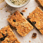 Close-up of homemade granola bars cut up into rectangles.