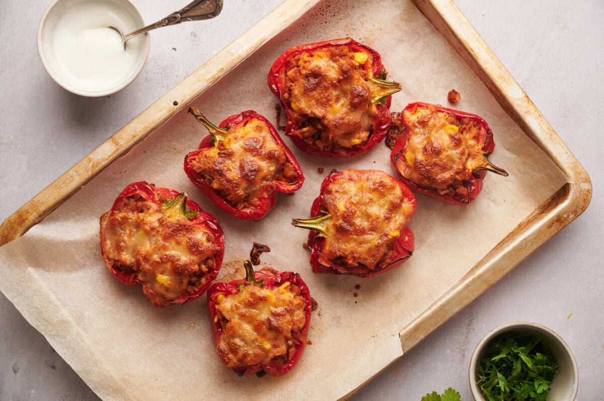 Baked stuffed peppers with golden brown mozzarella.