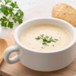 Creamy potato soup garnished with parsley
