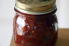 A sealed jar of Tomato Ginger Jam.